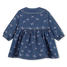 Back view of Billieblush girls blue denim dress with all-over pink bows and gathered skirt