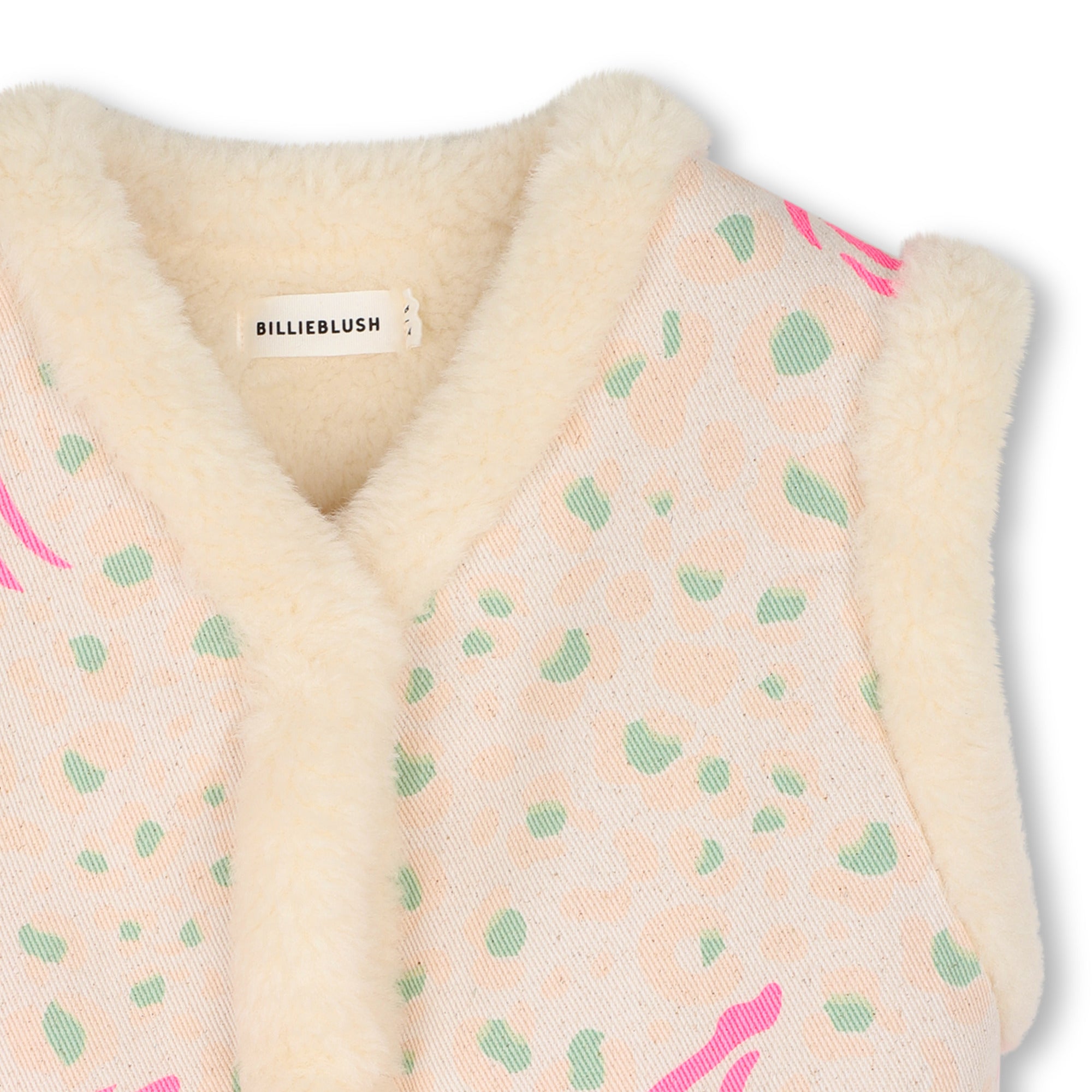 Close-up of Billieblush printed gilet with cream fluffy neckline and pink pattern