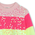 Close-up of Billieblush girls sequin jumper showing colourful stripes and shimmering embellishments