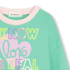 Billieblush girls green sweatshirt close up of slogan detail.