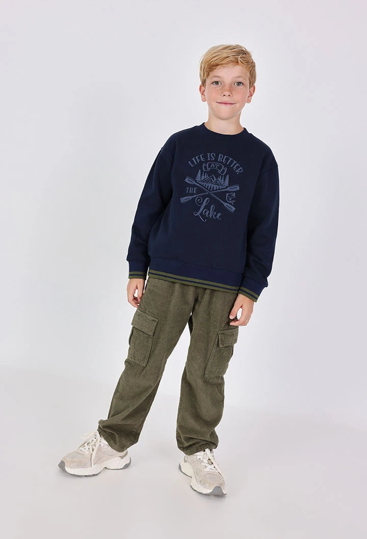 Boy wearing Boboli khaki cotton fleece cargo jogger trousers with navy jumper