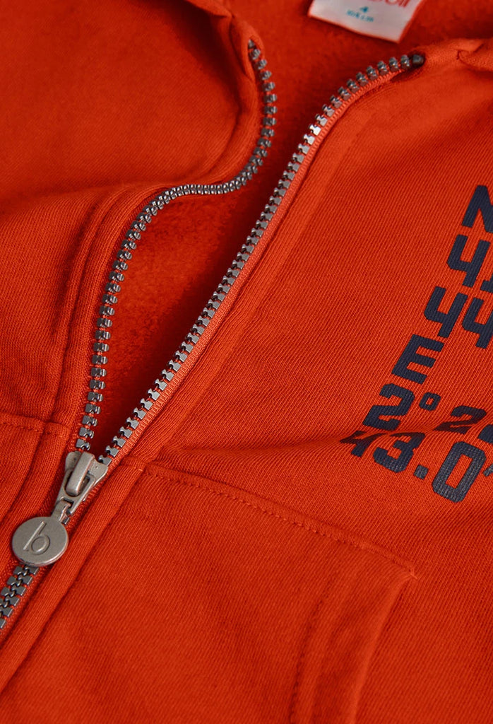 Close-up of zip fastening and chest print on Boboli boys orange hoodie