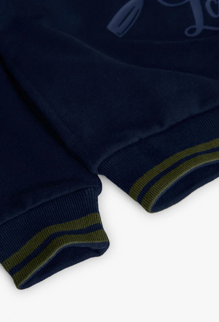 Cuffed hem detail of Boboli Boys Oar Motif navy fleece sweatshirt.