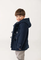 Boboli boys navy duffle coat styled on toddler model with hood and toggle detail