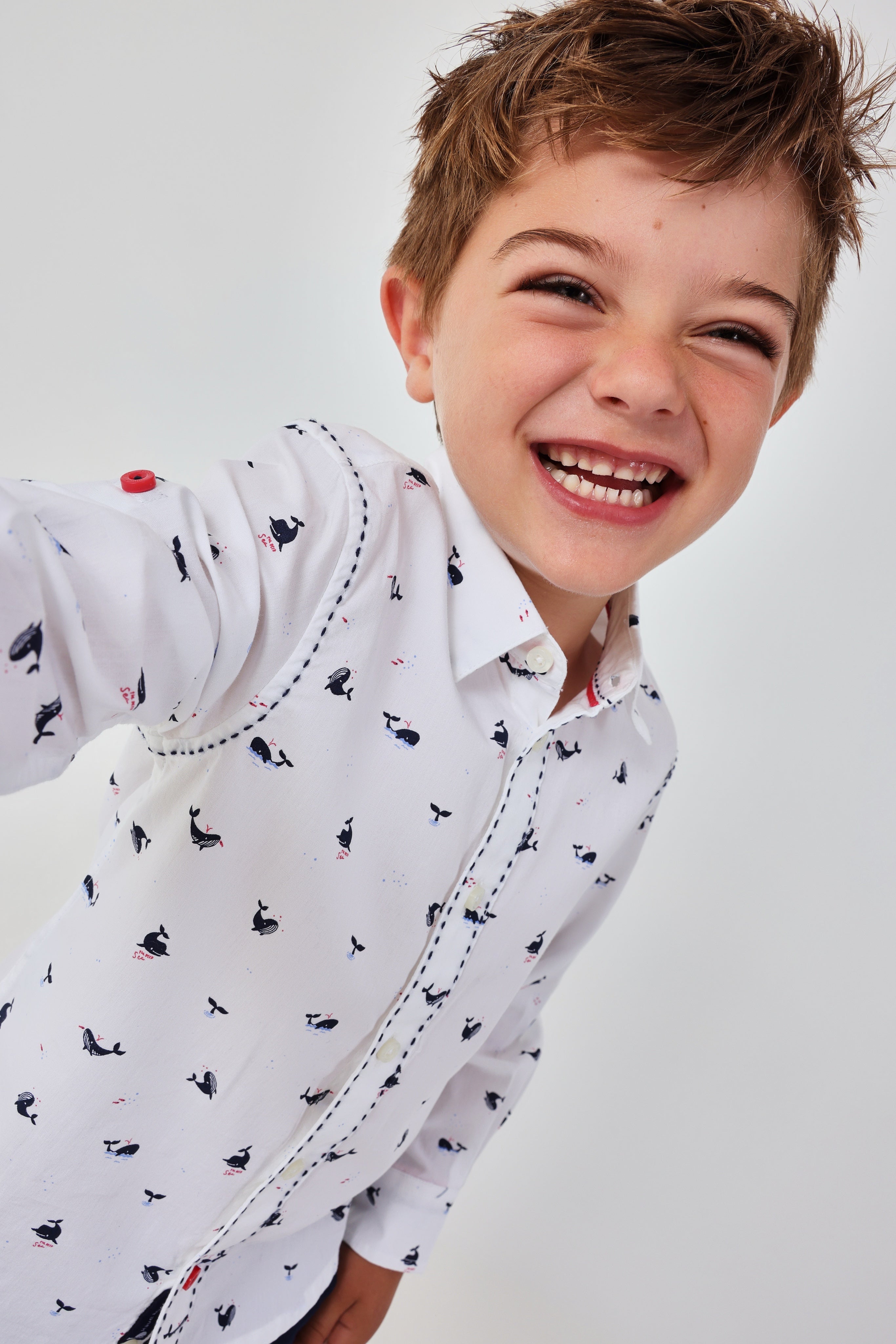Boboli boys white whale print occasion shirt smiling model view