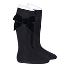 Side view of Condor girls navy knee high socks showing velvet bow detail