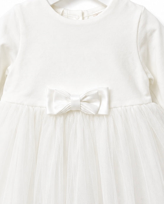 Close-up of the embroidered lace hem on the iDO Mini ivory tulle christening dress