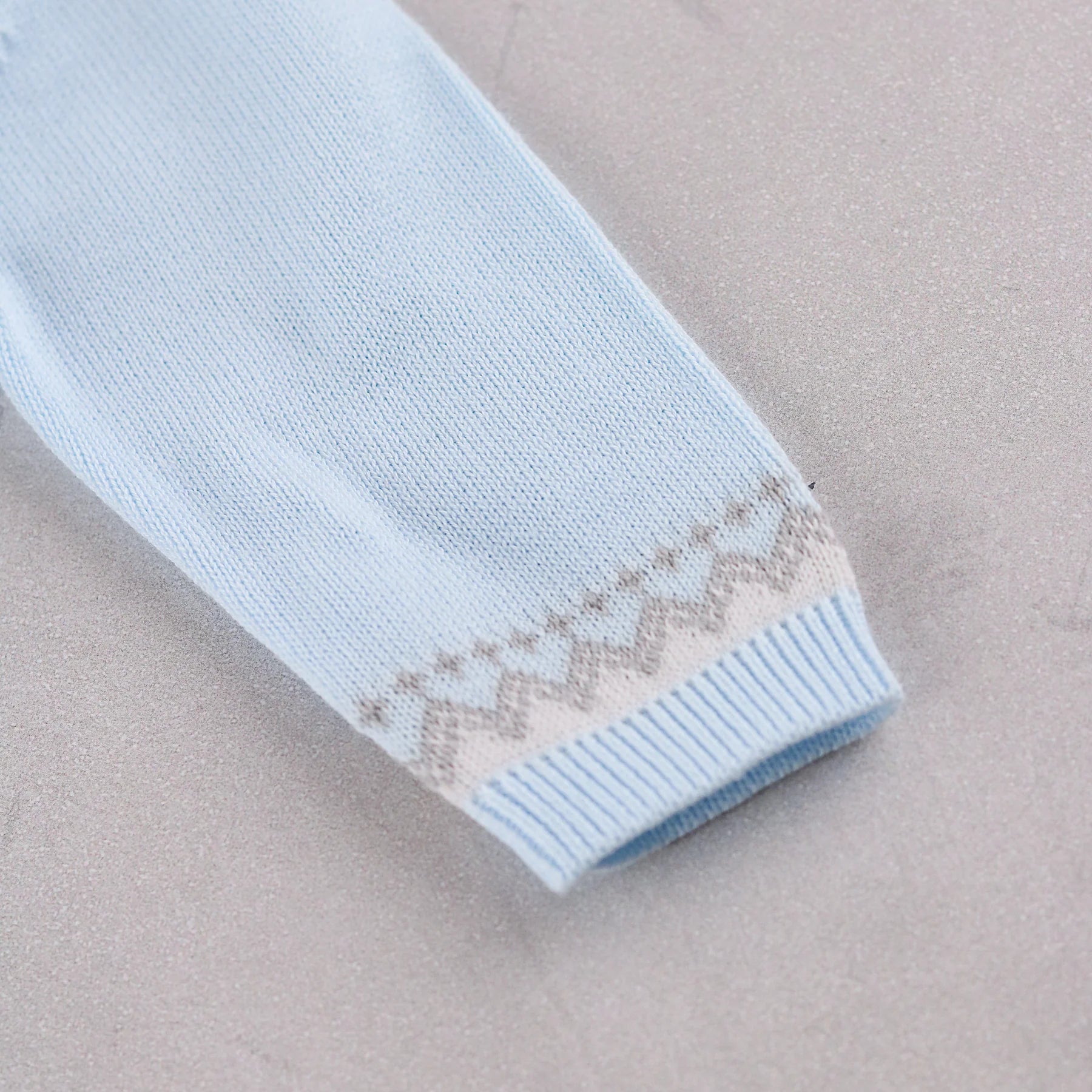 Emile et Rose Milo baby boys knitted romper neckline and button fastening detail