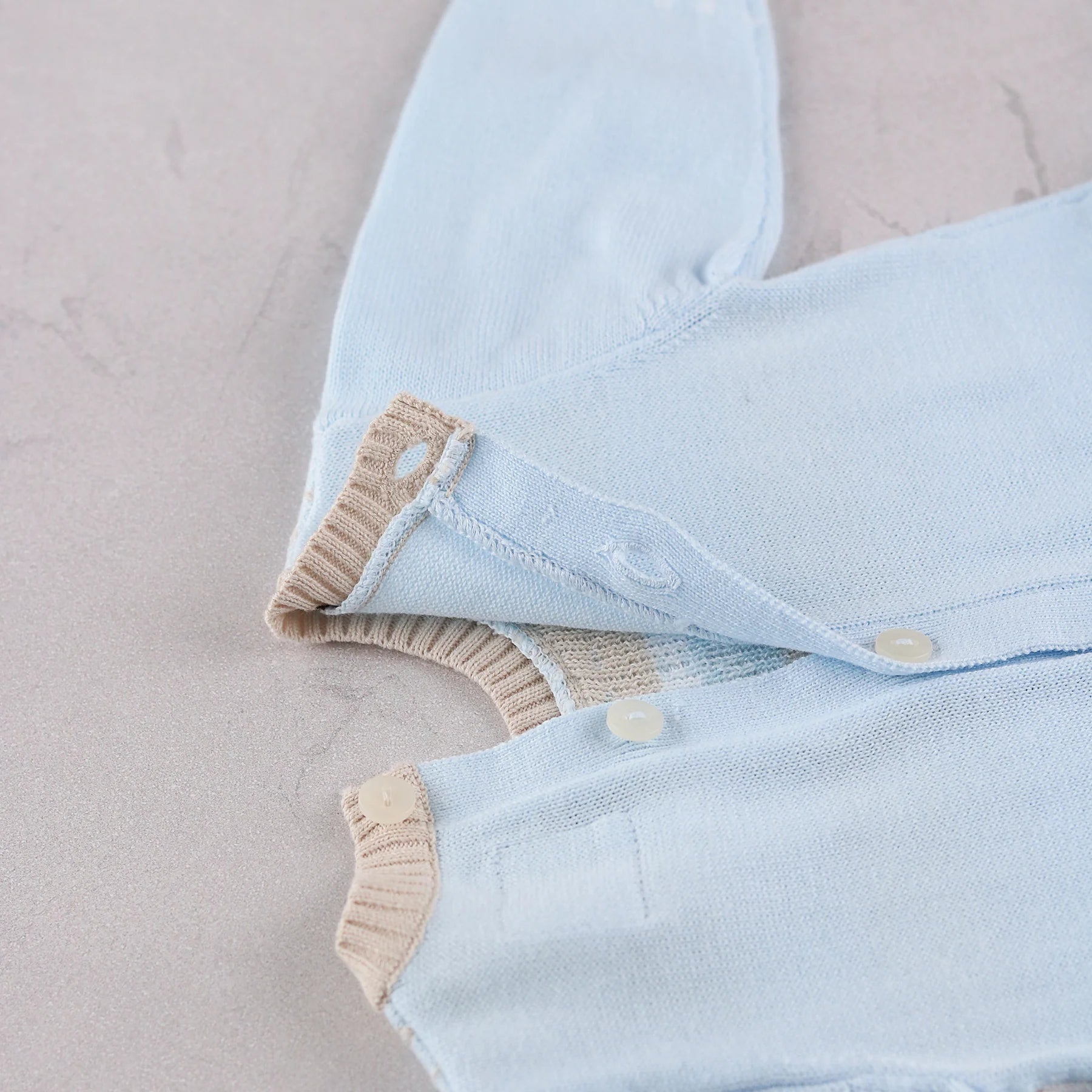  Emile et Rose Magnus blue knitted baby boys romper button back fastening detail