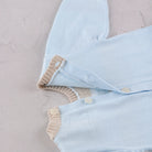  Emile et Rose Magnus blue knitted baby boys romper button back fastening detail