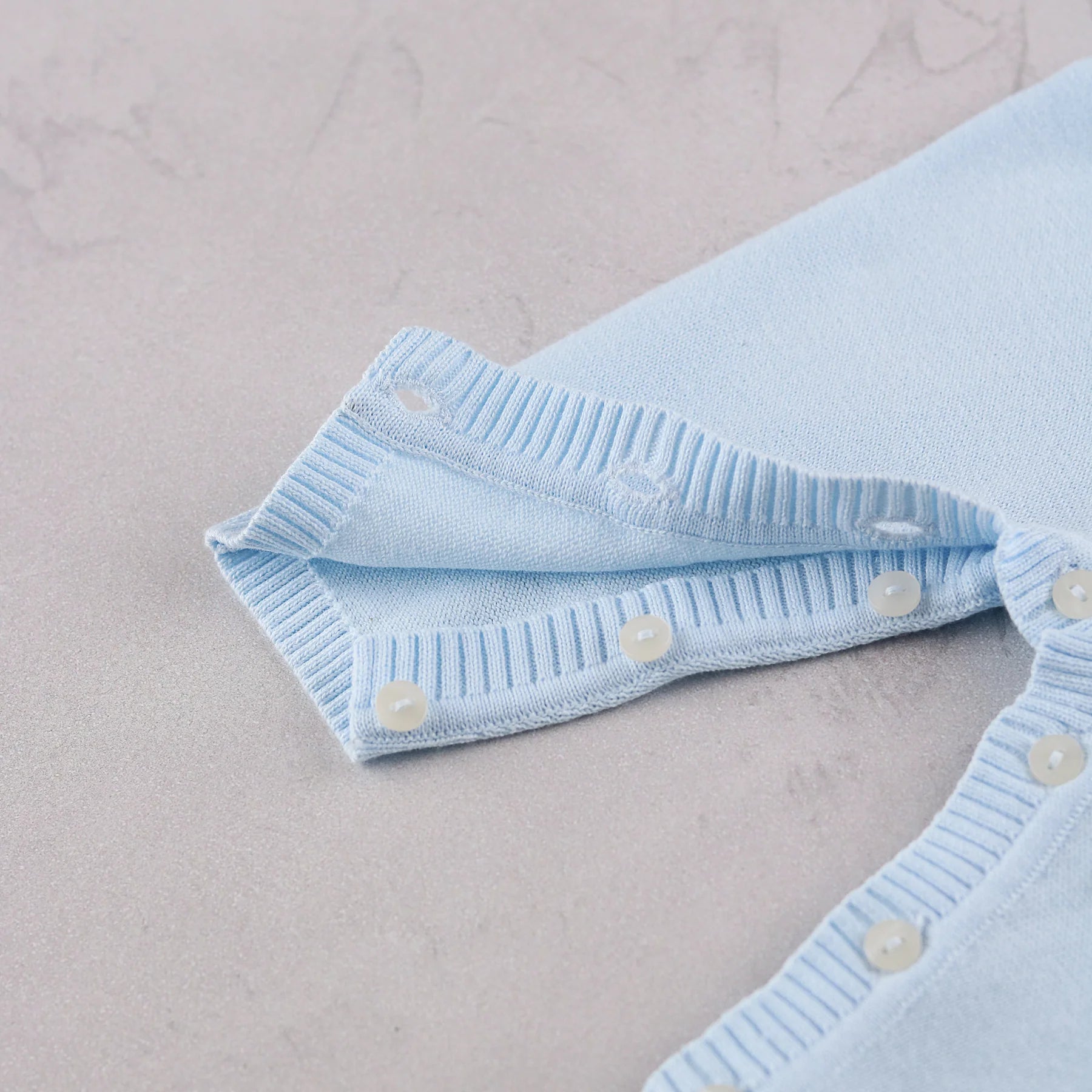 Emile et Rose Magnus pale blue baby boys romper leg and foot button detail