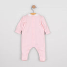 Baby girl in Emile et Rose Madeleine pink romper from the back