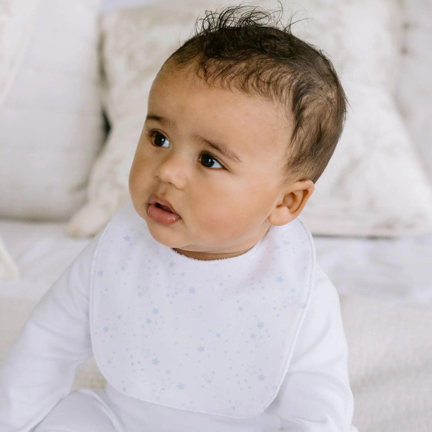 Baby wearing the Emile et Rose Trenton pale blue boys bib