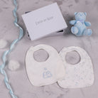 Emile et Rose Trenton pale blue teddy bear and two baby bibs with star print and embroidered design in a white gift box