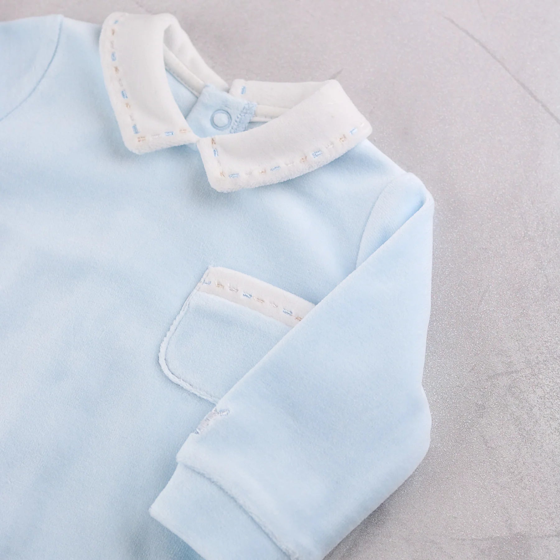 Close-up of Emile et Rose Mason embroidered collar and pocket detail