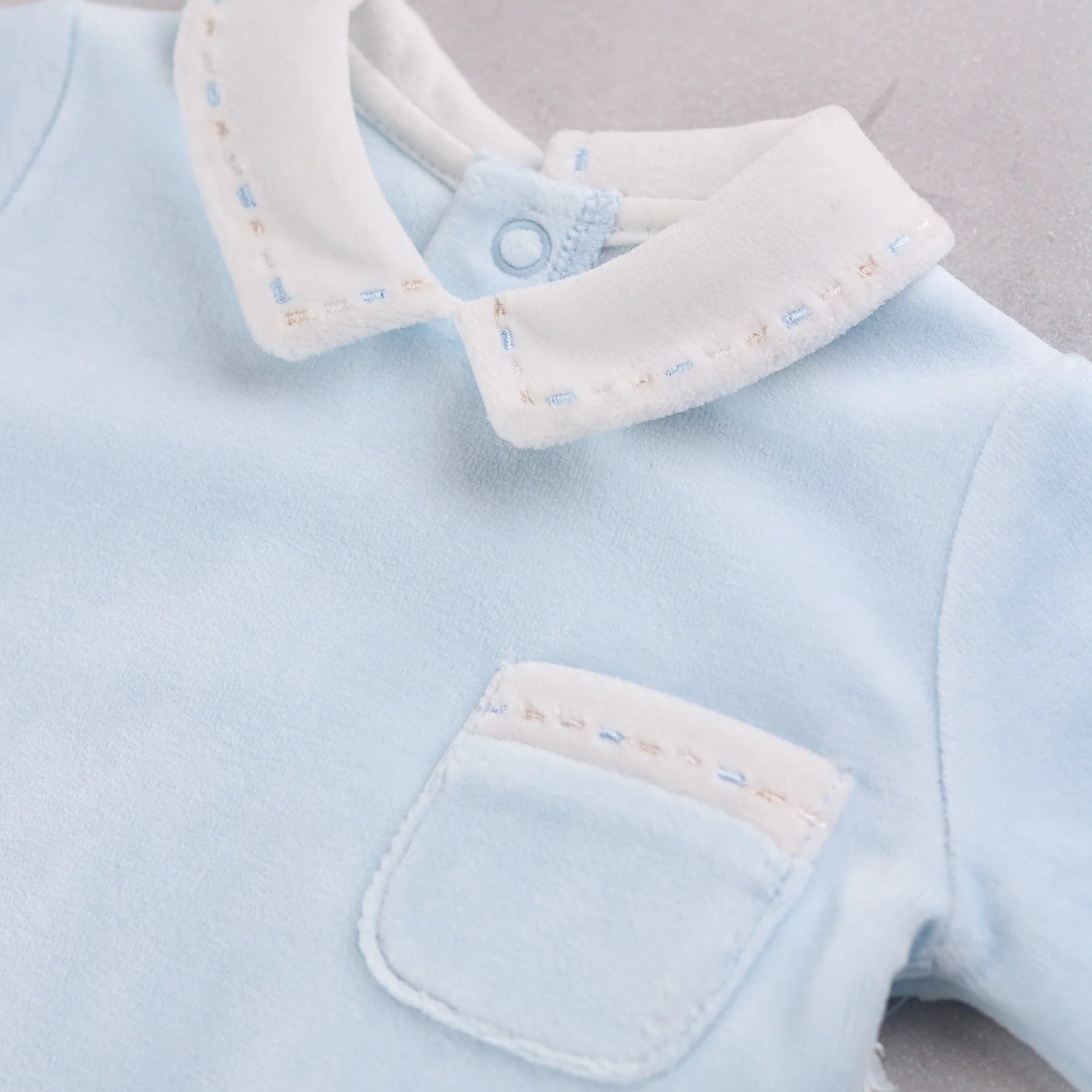 Close-up of Emile et Rose Mason white embroidered collar detail