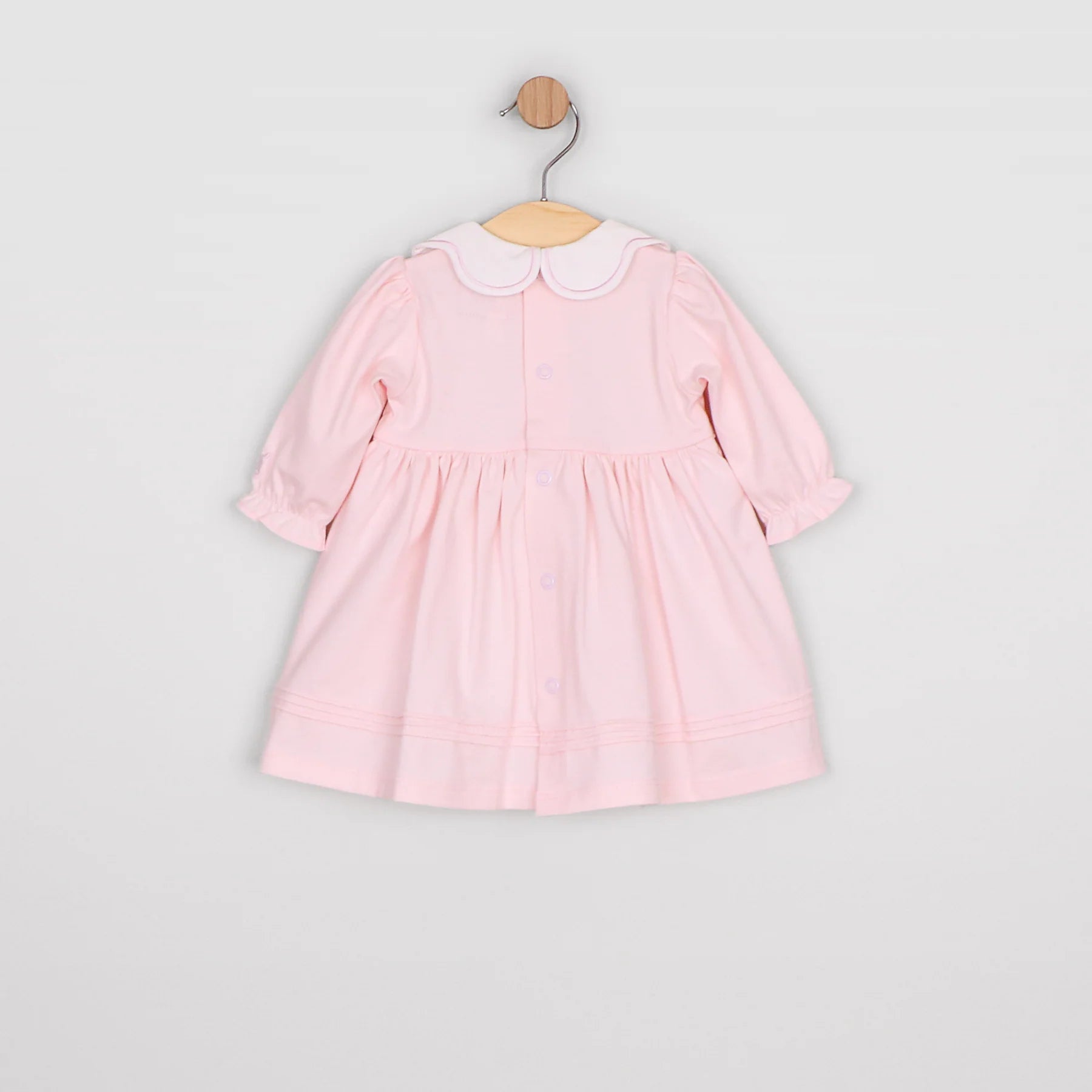 Back view of the Emile et Rose Maggie pale pink baby occasion dress