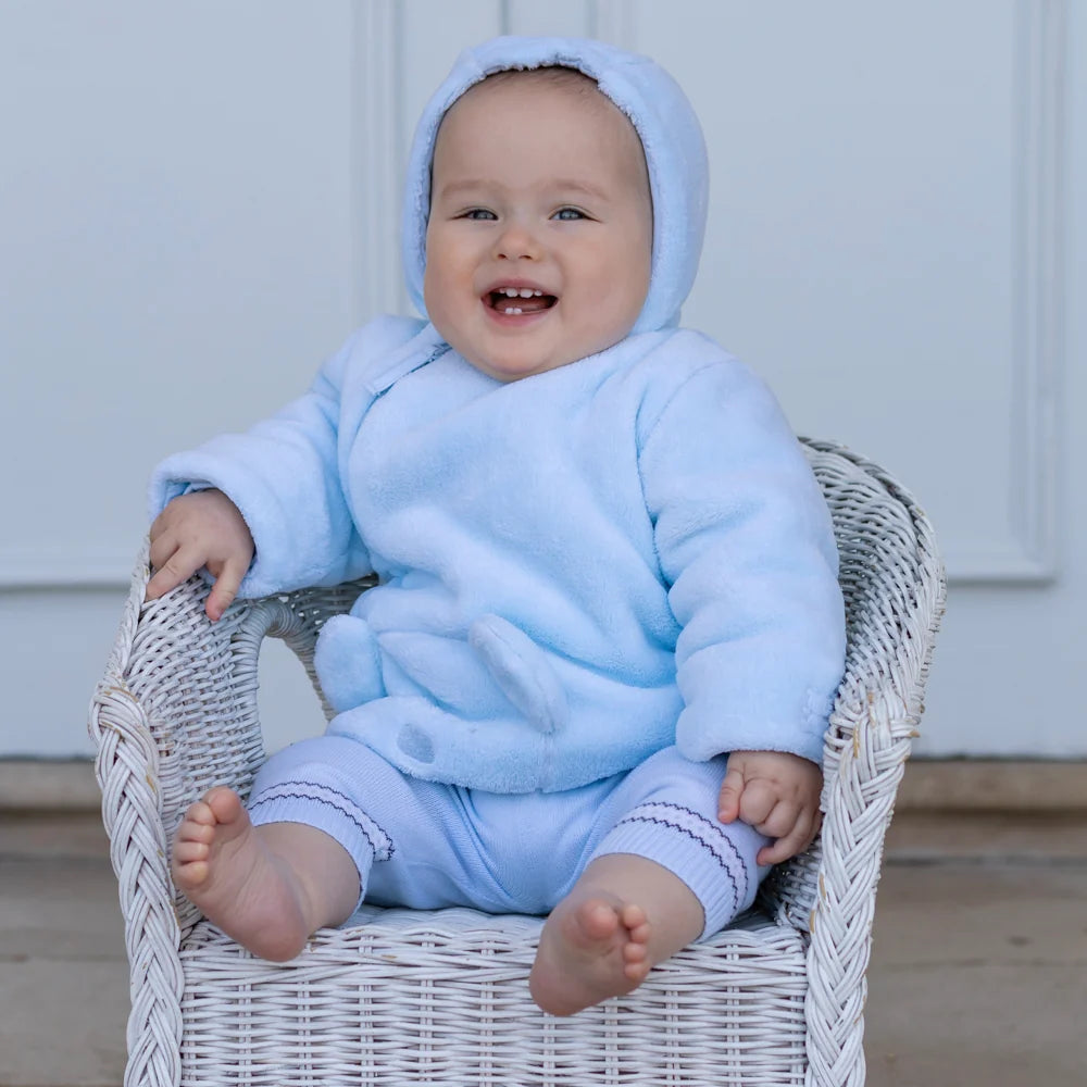 Baby wearing the Emile et Rose Axel pale blue fleece jacket