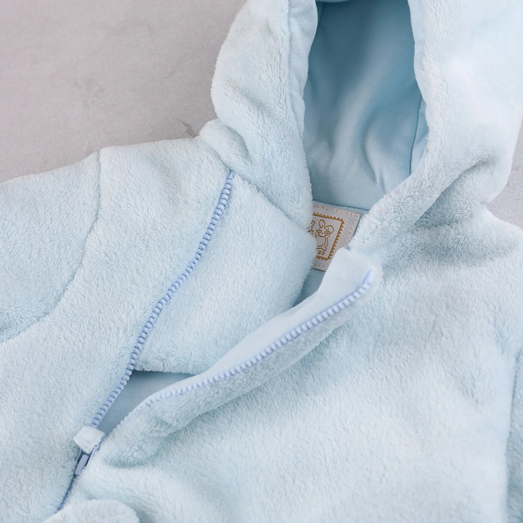  Close-up of the hood lining on the Emile et Rose Axel baby boys blue  jacket