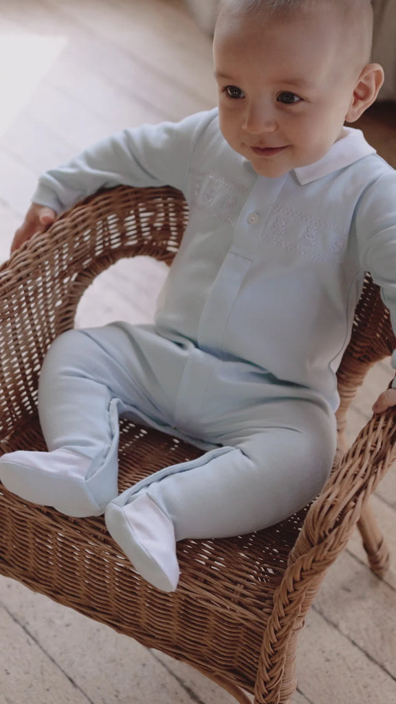 Baby boy wearing Emile et Rose Fisher blue and white romper 