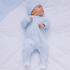 Newborn Baby boy wearing Emile et Rose Fisher blue babygrow and hat