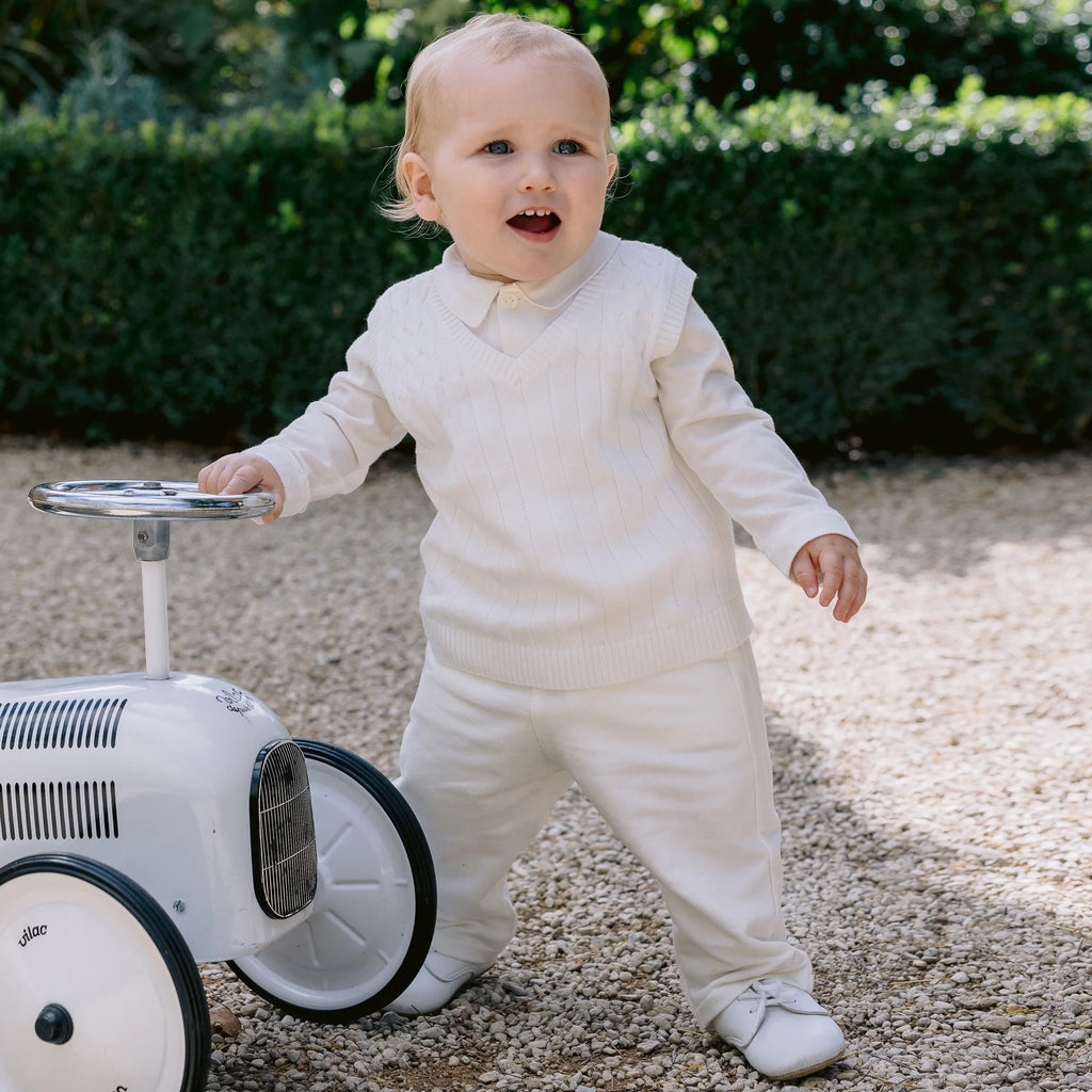 Emile et Rose George baby boys ivory three piece set outdoors with toy car