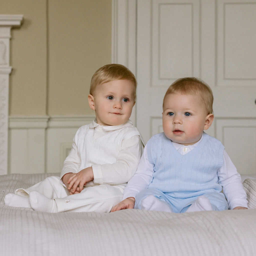 Emile et Rose George ivory three piece baby boys outfit seated with another baby