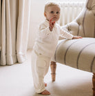 Emile et Rose George baby boys ivory three piece set side view standing