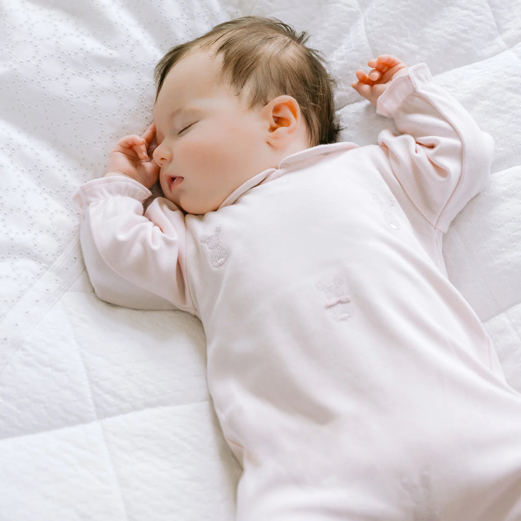Newborn baby sleeping in Emile et Rose Kallie Pink Bunny Babygrow Gift set 