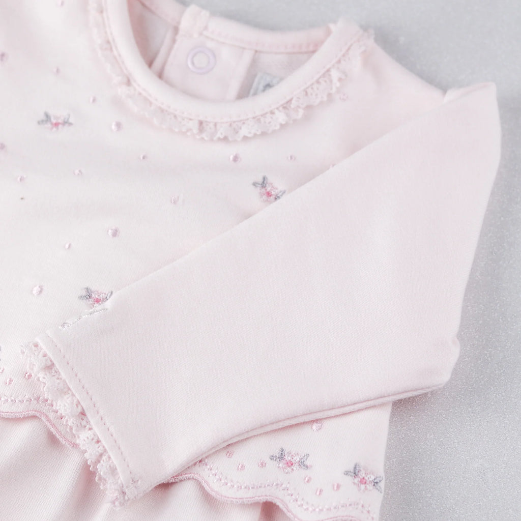 Yoke embroidery and long sleeve detail on Emile et Rose Katerina pink babygrow.