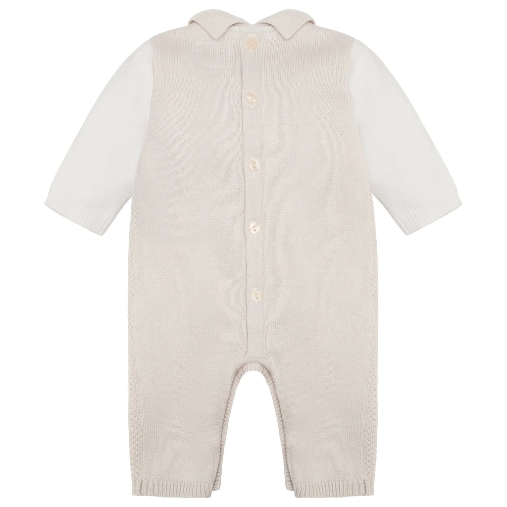 Flatlay of Emile et Rose Kenzie smart knitted babygrow with textured stone knit