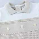 Close-up of collar and pearlised buttons on Emile et Rose Kenzie babygrow