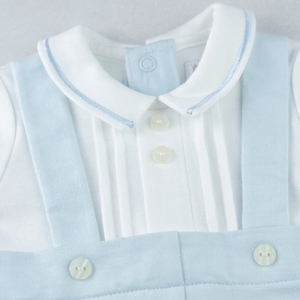 Detail of mock braces with fixed button and tiny pockets on Kingsley Emile et Rose boys babygrow.
