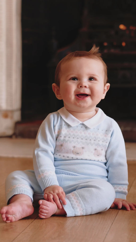 Baby boy wearing Emile et Rose Kipling blue teddy knit outfit set.