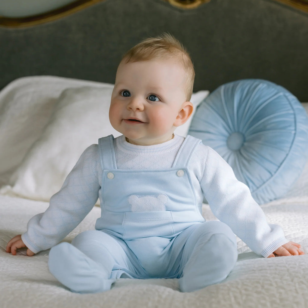 Baby boy wearing Emile et Rose Kit Blue Teddy Dungaree Babygrow sitting