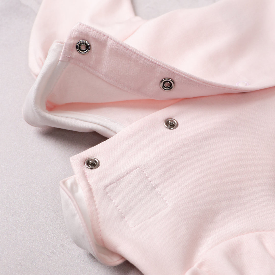 Emile et Rose pink baby babygrow popper fastening detail