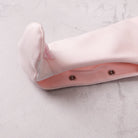 Emile et Rose pink babygrow foot detail with satin bows