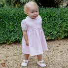 Emile et Rose baby girls pink occasion dress side profile full outfit