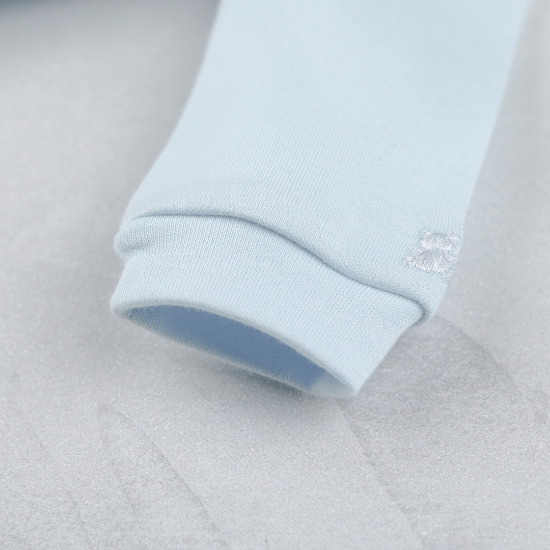 Emile et Rose baby boys blue babygrow close up sleeve hem detail