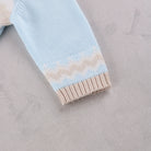 Close-up of Emile et Rose Martin knitted cuff detail