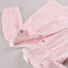 Back view of the Emile et Rose Michelle pale pink baby girls velour outfit showing popper fastening