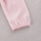 Detail of the bunny embroidery on the sleeve of Emile et Rose Michelle baby girls outfit