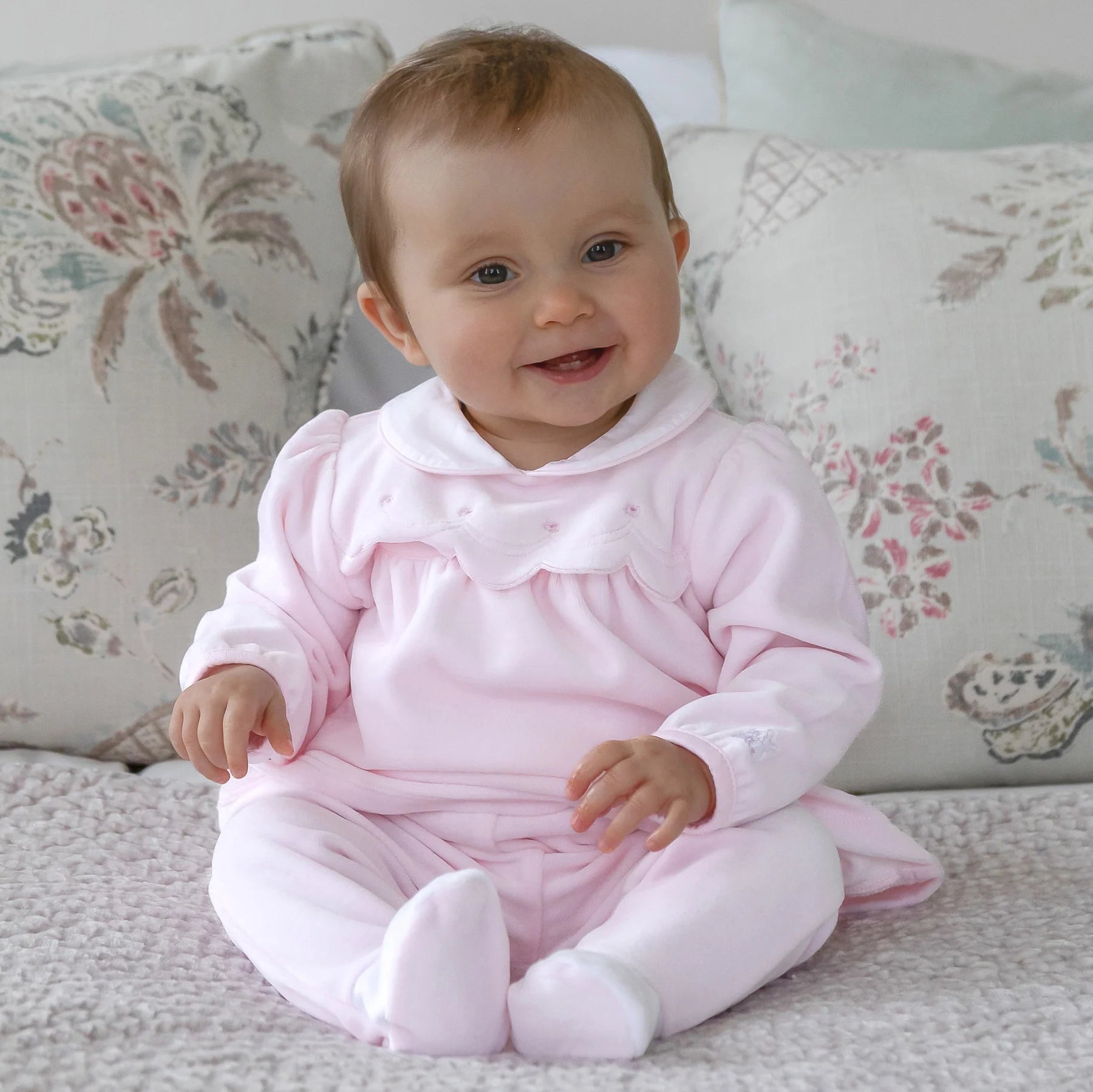 Baby wearing the Emile et Rose Michelle pale pink velour outfit gift set