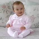 Baby wearing the Emile et Rose Michelle pale pink velour outfit gift set