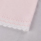 Close-up of the knitted detail on the Pink baby girls  Emile et Rose Millie dress