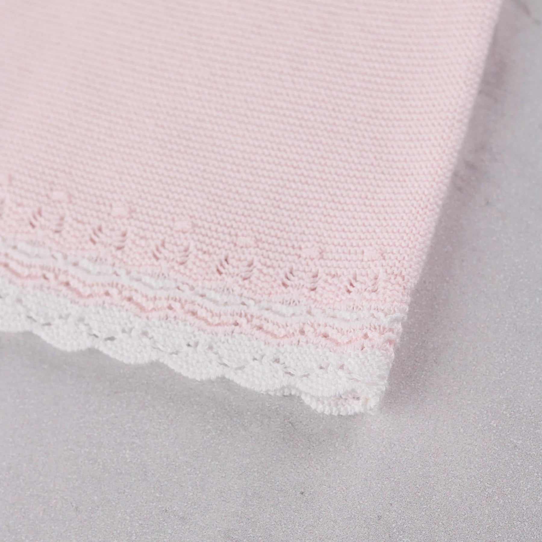 Close-up of the knitted detail on the Pink baby girls  Emile et Rose Millie dress