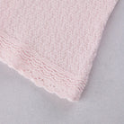 Close-up of the knitted cuff detail on the Emile et Rose Minny baby girls outfit set