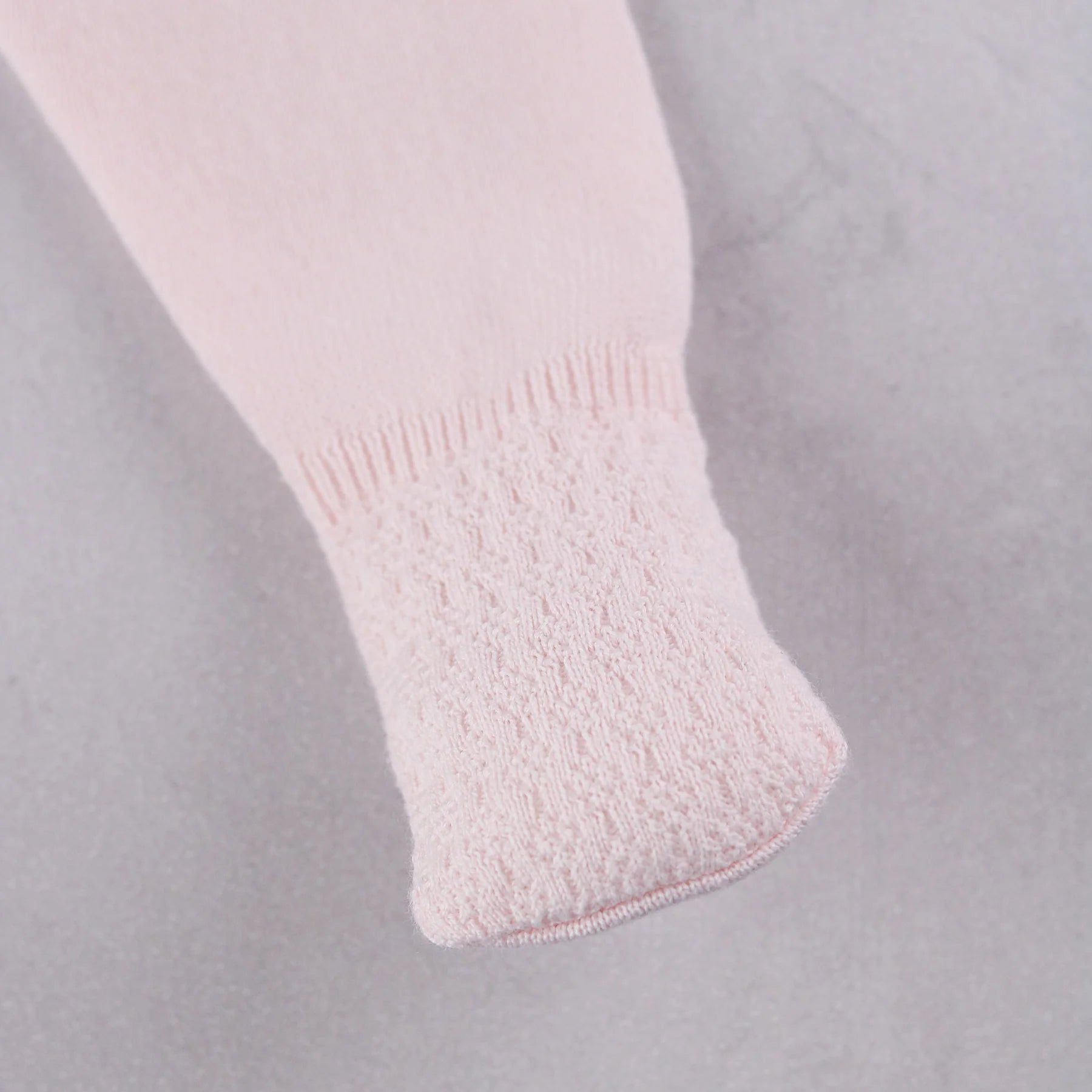 Coordinating footed leggings from the Emile et Rose Minny baby girls knit outfit set