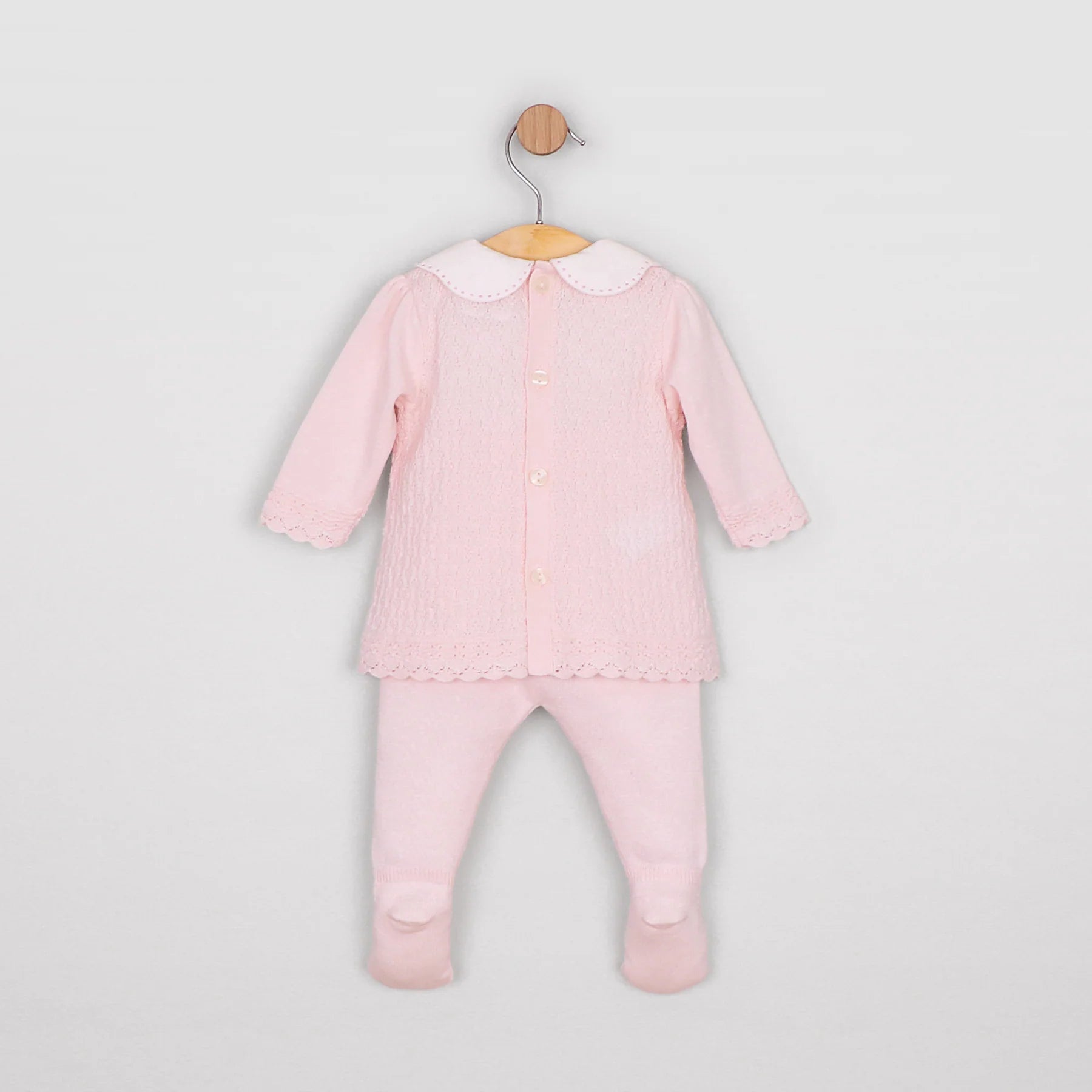 Back view of the Emile et Rose Minny pale pink baby girls knit top showing button fastening