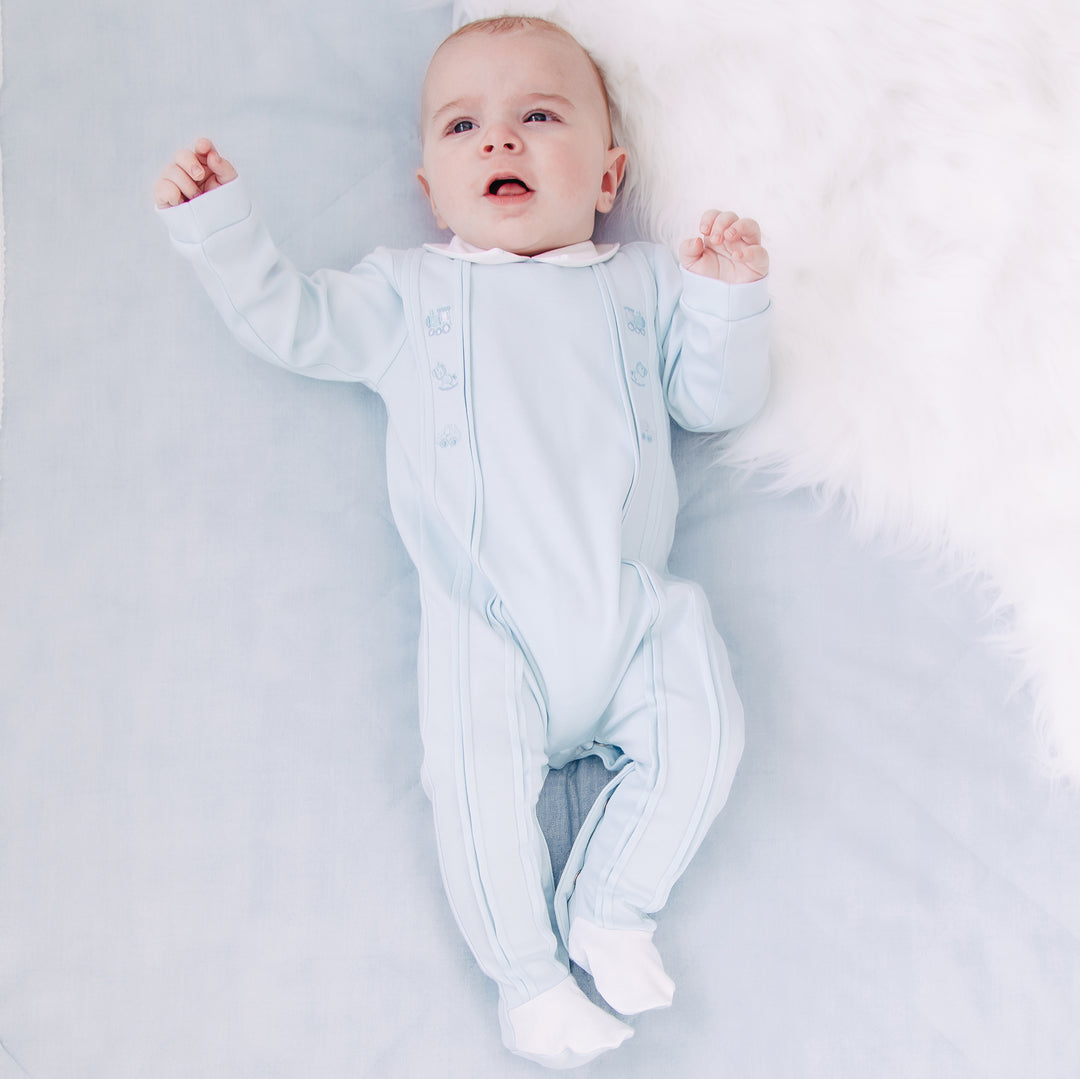 Emile et Rose baby boys blue babygrow lying flat full length